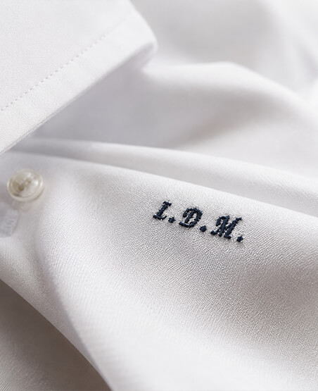 Custom initials embroidered on a men's shirt