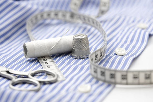 Close-up of buttons sewn onto a men's shirt